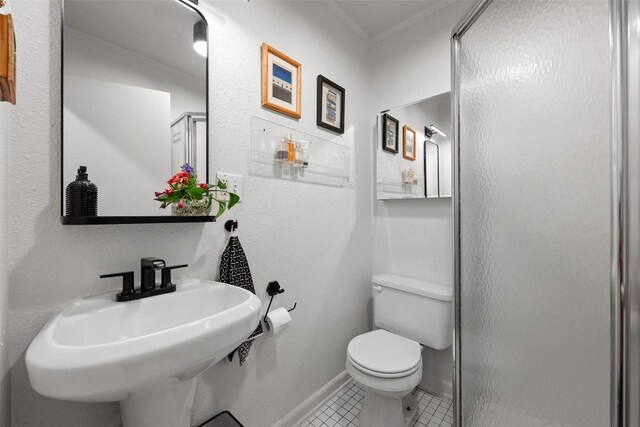 109 W 55th 1/2 St, Austin, TX 78751 - full bathroom featuring ornamental molding, a shower stall, toilet, a sink, and tile patterned flooring