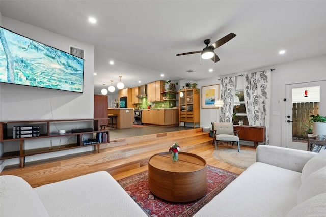 109 W 55th 1/2 St, Austin, TX 78751 - living room with recessed lighting, light wood-style floors, and ceiling fan