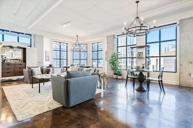 311 W 5th St W Unit 902, Austin, TX 78701 - living room featuring a chandelier, concrete floors, healthy amount of natural light, and baseboards