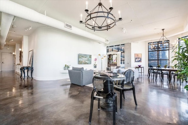 311 W 5th St W Unit 902, Austin, TX 78701 - dining space with a chandelier, finished concrete floors, and baseboards
