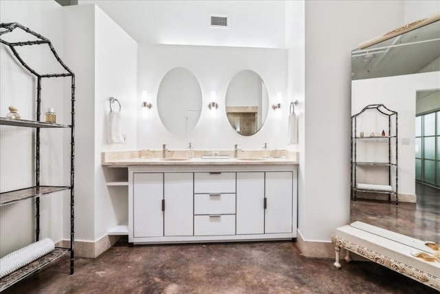 311 W 5th St W Unit 902, Austin, TX 78701 - full bath with concrete floors, double vanity, and baseboards