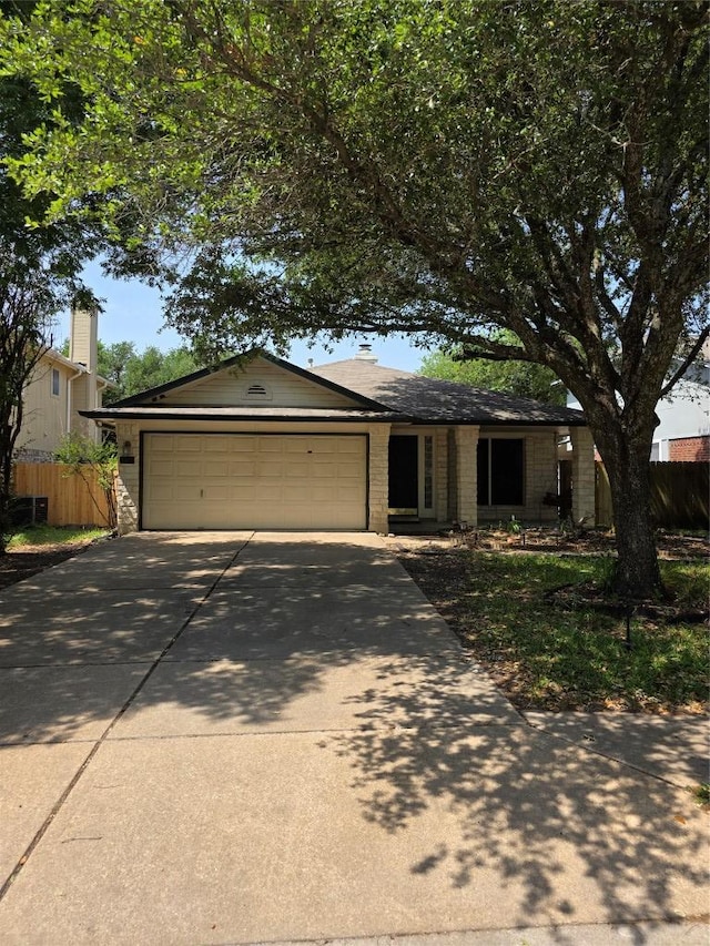3401 Kissman Dr, Austin, TX 78728 - ranch-style home featuring driveway, a garage, and brick siding