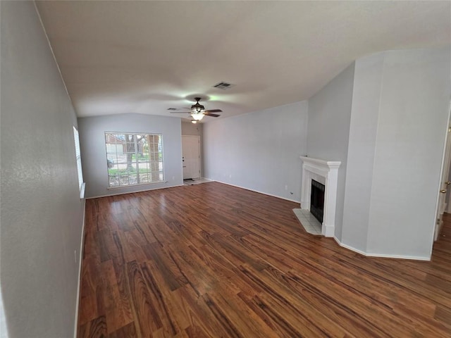 3401 Kissman Dr, Austin, TX 78728 - unfurnished living room featuring wood finished floors, ceiling fan, a fireplace, baseboards, and lofted ceiling