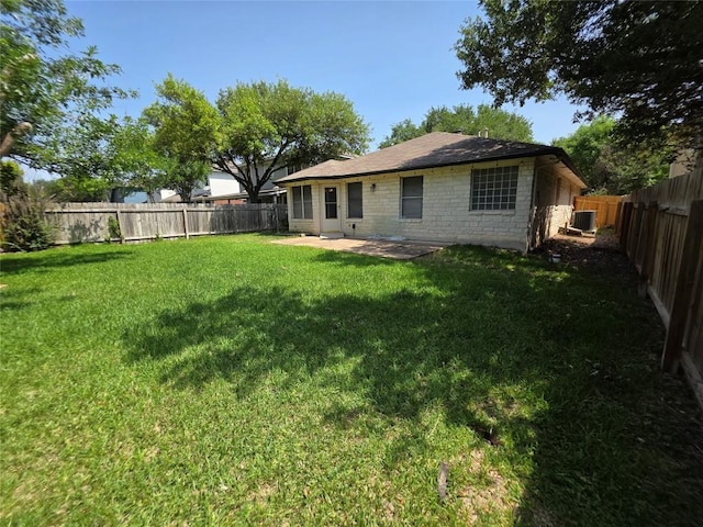 3401 Kissman Dr, Austin, TX 78728 - back of property with a patio, stone siding, and central AC