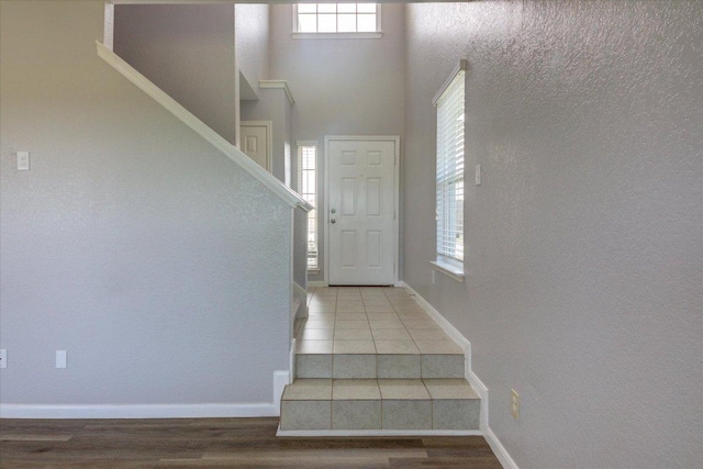 1519 Shenandoah Cv, Lockhart, TX 78644 - stairs with baseboards and wood finished floors