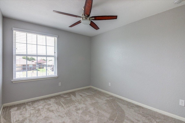 1519 Shenandoah Cv, Lockhart, TX 78644 - unfurnished room featuring a ceiling fan, light colored carpet, and baseboards