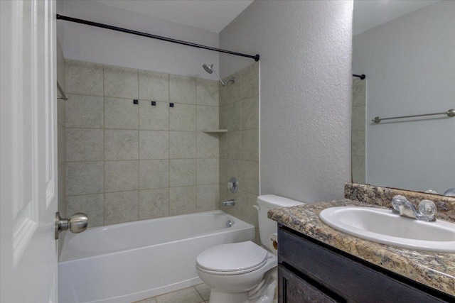 1519 Shenandoah Cv, Lockhart, TX 78644 - full bathroom featuring toilet, a textured wall, vanity, shower / bathtub combination, and tile patterned flooring