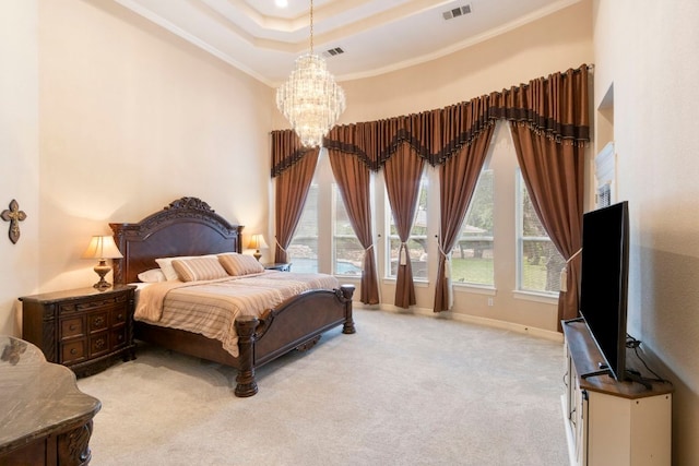 15 Sarazen Loop N, Georgetown, TX 78628 - bedroom with a chandelier, crown molding, carpet flooring, and a tray ceiling