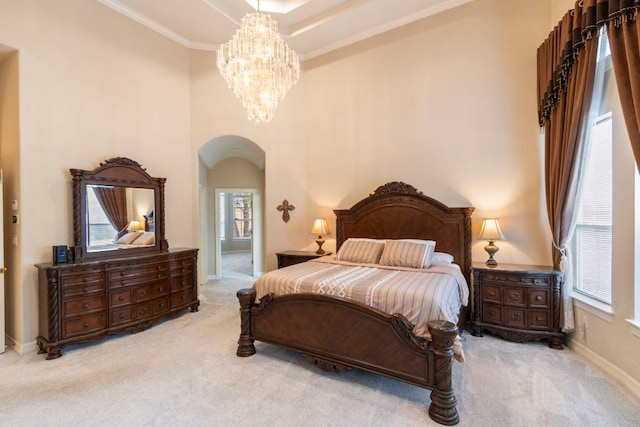 15 Sarazen Loop N, Georgetown, TX 78628 - carpeted bedroom with arched walkways, multiple windows, a chandelier, ornamental molding, and a high ceiling