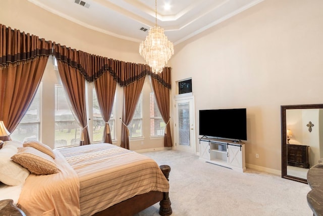 15 Sarazen Loop N, Georgetown, TX 78628 - bedroom with a chandelier, carpet, a towering ceiling, crown molding, and a tray ceiling