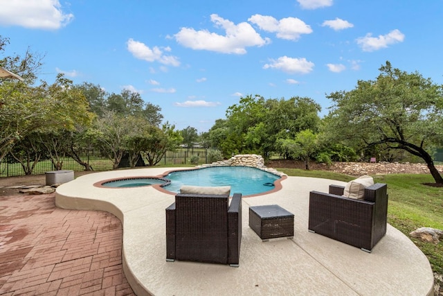 15 Sarazen Loop N, Georgetown, TX 78628 - view of swimming pool with a patio area, a fenced backyard, and a pool with connected hot tub
