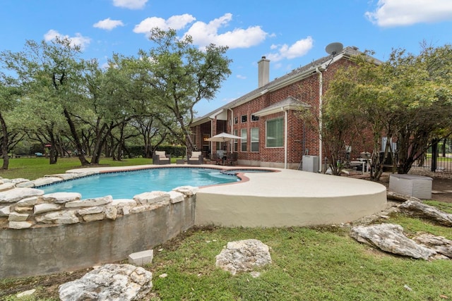 15 Sarazen Loop N, Georgetown, TX 78628 - outdoor pool with a patio and a lawn