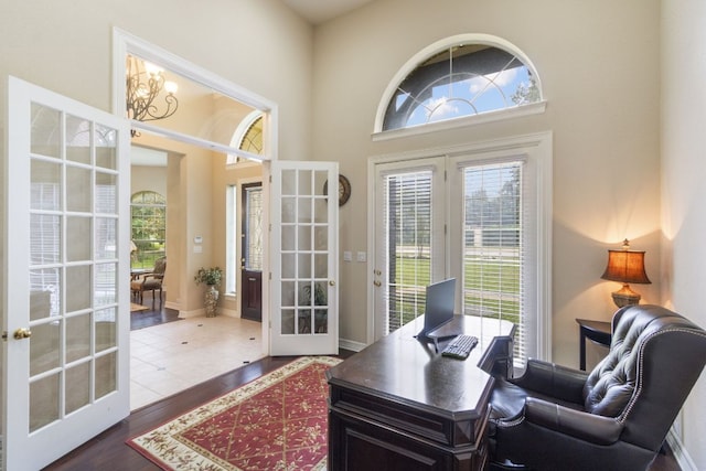 15 Sarazen Loop N, Georgetown, TX 78628 - home office with french doors, dark wood-type flooring, and a towering ceiling