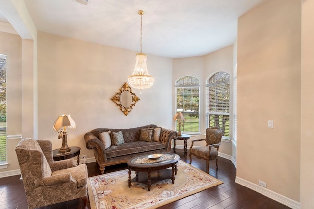 15 Sarazen Loop N, Georgetown, TX 78628 - living area featuring dark wood-style floors and a chandelier