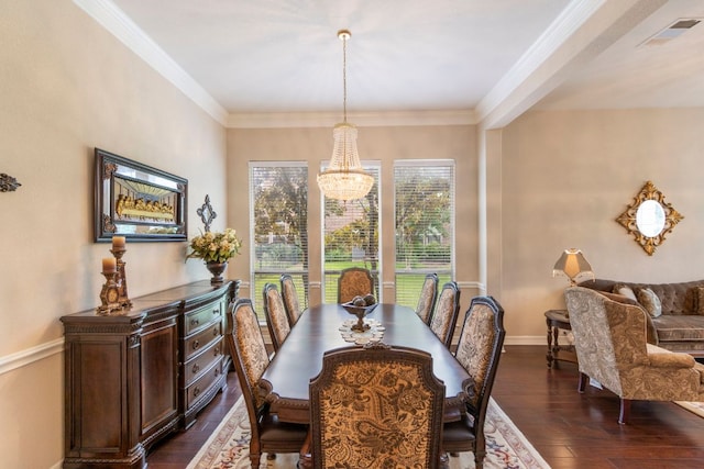 15 Sarazen Loop N, Georgetown, TX 78628 - dining space with a chandelier, dark wood-style flooring, and crown molding