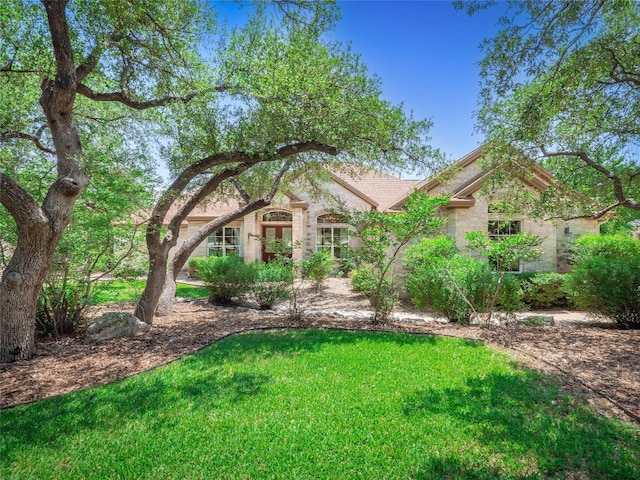 104 E Rustle Cv, Georgetown, TX 78628 - view of front of house with a front lawn