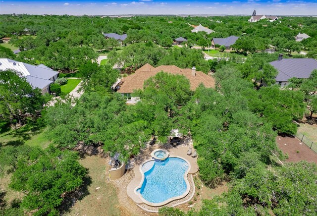 104 E Rustle Cv, Georgetown, TX 78628 - aerial view of property and surrounding area featuring a pool area