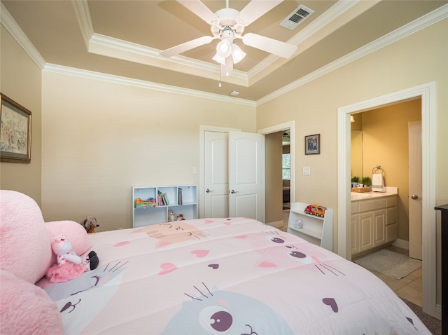 104 E Rustle Cv, Georgetown, TX 78628 - bedroom with a tray ceiling, ornamental molding, connected bathroom, and a ceiling fan