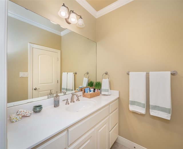 104 E Rustle Cv, Georgetown, TX 78628 - bathroom featuring ornamental molding, vanity, and baseboards