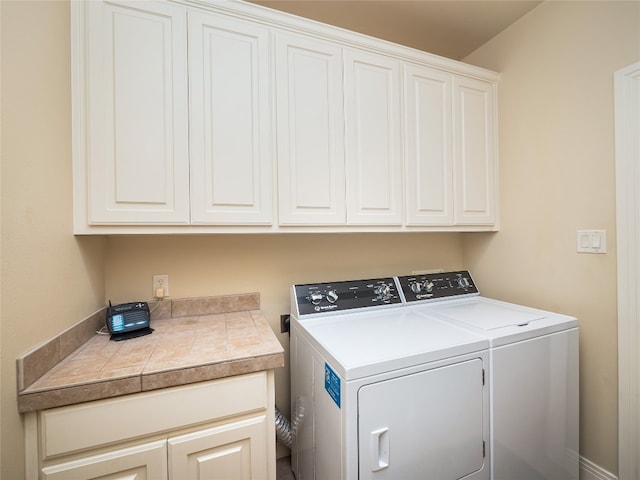 104 E Rustle Cv, Georgetown, TX 78628 - laundry area with independent washer and dryer and cabinet space