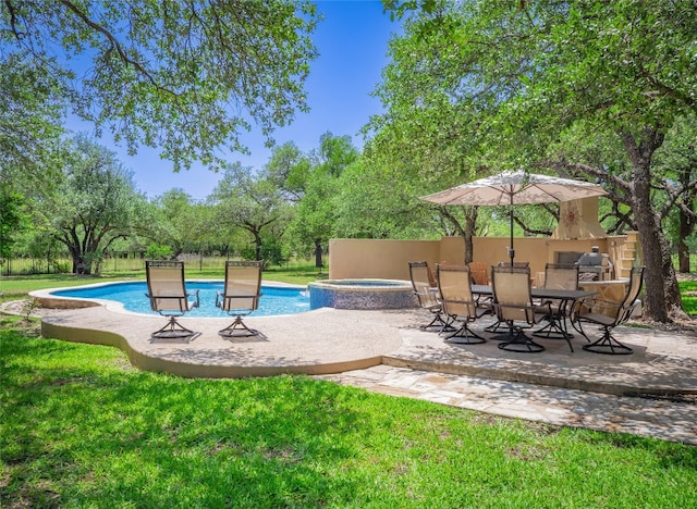 104 E Rustle Cv, Georgetown, TX 78628 - view of swimming pool with a patio area and an in-ground hot tub