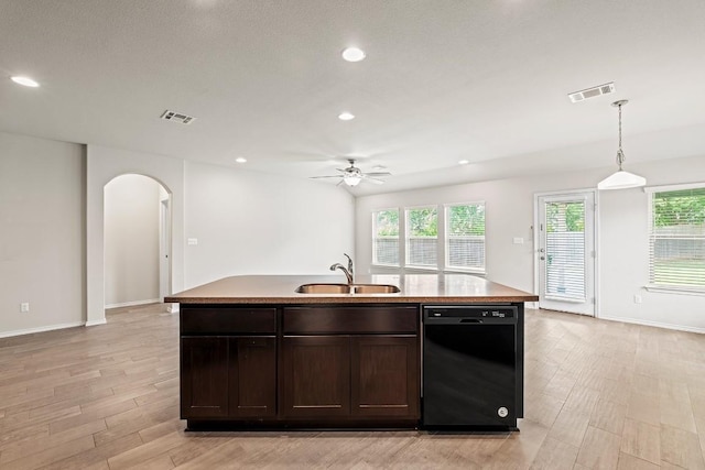 1012 Chad Loop, Round Rock, TX 78665 - kitchen with black dishwasher, ceiling fan, arched walkways, recessed lighting, and a center island with sink