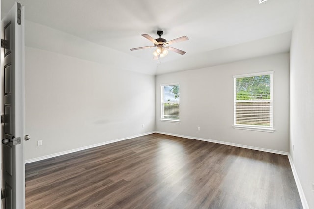 1012 Chad Loop, Round Rock, TX 78665 - spare room with plenty of natural light, dark wood-type flooring, a ceiling fan, and baseboards