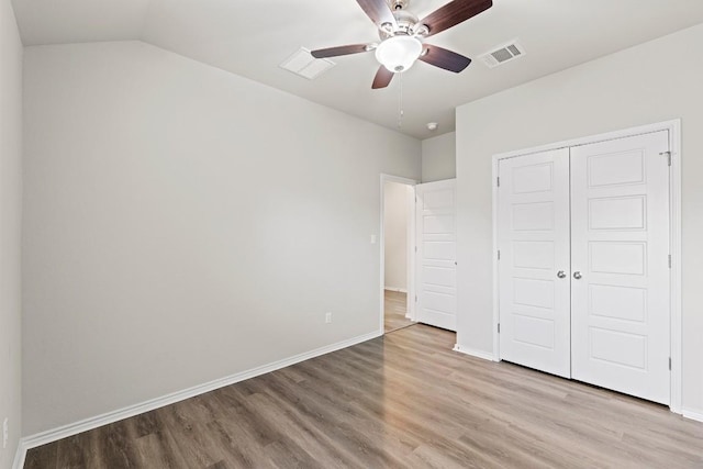 1012 Chad Loop, Round Rock, TX 78665 - unfurnished bedroom with light wood finished floors, a closet, ceiling fan, and lofted ceiling