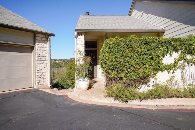 1520 Ben Crenshaw Way Unit 120, Austin, TX 78746 - entrance to property with stone siding and roof with shingles