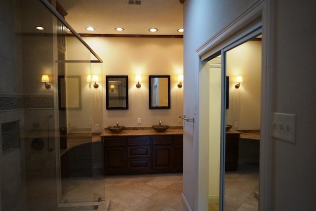 1520 Ben Crenshaw Way Unit 120, Austin, TX 78746 - bathroom featuring double vanity, a stall shower, recessed lighting, and tile patterned floors