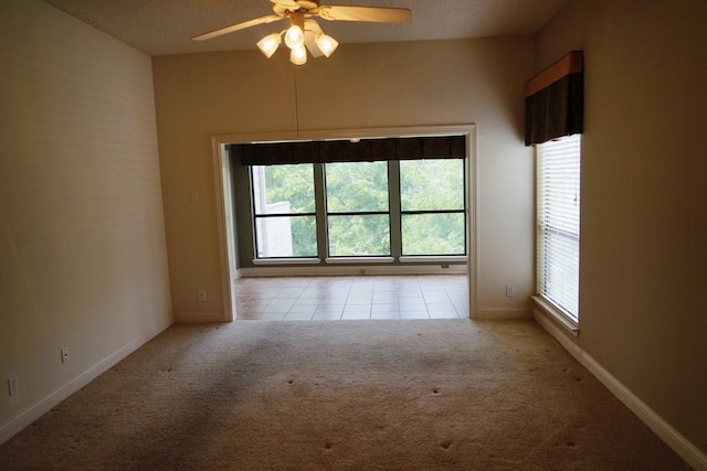 1520 Ben Crenshaw Way Unit 120, Austin, TX 78746 - tiled empty room featuring carpet flooring, healthy amount of natural light, ceiling fan, and baseboards