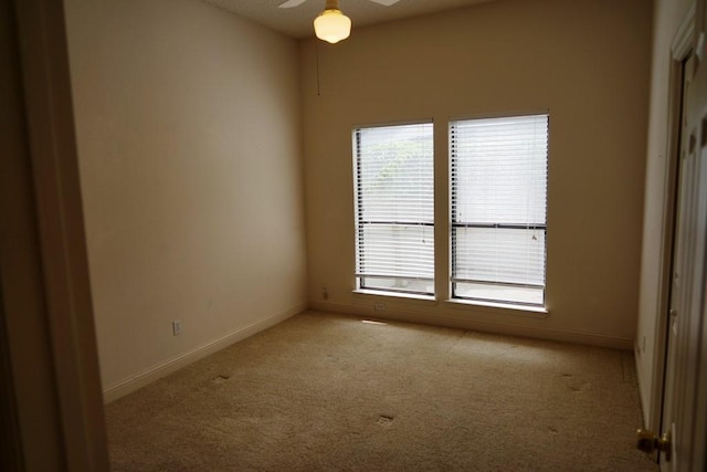1520 Ben Crenshaw Way Unit 120, Austin, TX 78746 - carpeted empty room featuring plenty of natural light, ceiling fan, and baseboards