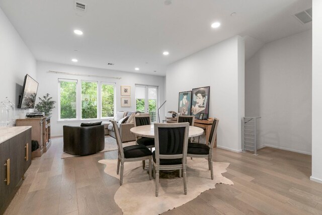 3100 Menchaca Rd Unit 33, Austin, TX 78704 - dining room featuring light wood-style floors, recessed lighting, and baseboards