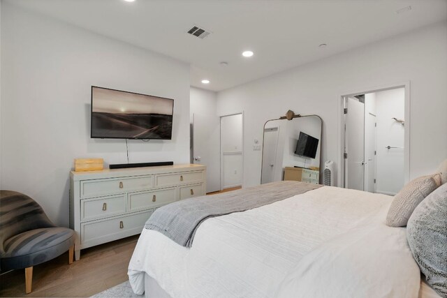 3100 Menchaca Rd Unit 33, Austin, TX 78704 - bedroom featuring wood finished floors and recessed lighting