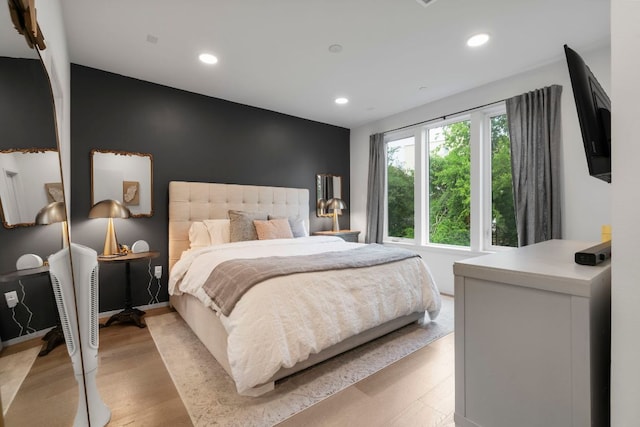 3100 Menchaca Rd Unit 33, Austin, TX 78704 - bedroom with light wood-style flooring and recessed lighting