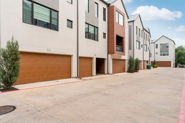 3100 Menchaca Rd Unit 33, Austin, TX 78704 - view of building exterior featuring a garage and driveway