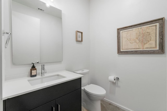 3100 Menchaca Rd Unit 33, Austin, TX 78704 - bathroom featuring vanity, toilet, and baseboards