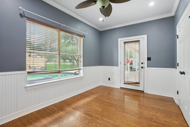 30418 La Quinta Dr, Georgetown, TX 78628 - entryway with a wainscoted wall, wood finished floors, a ceiling fan, and ornamental molding