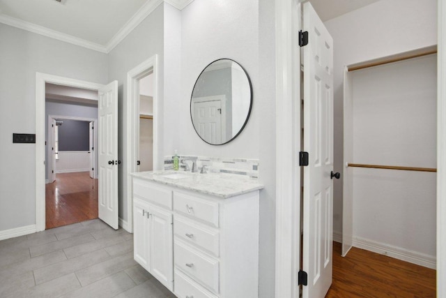30418 La Quinta Dr, Georgetown, TX 78628 - bathroom featuring crown molding, vanity, baseboards, and tile patterned floors