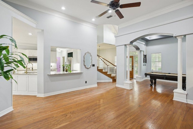 30418 La Quinta Dr, Georgetown, TX 78628 - rec room featuring ornate columns, ceiling fan, billiards, light wood-type flooring, and arched walkways