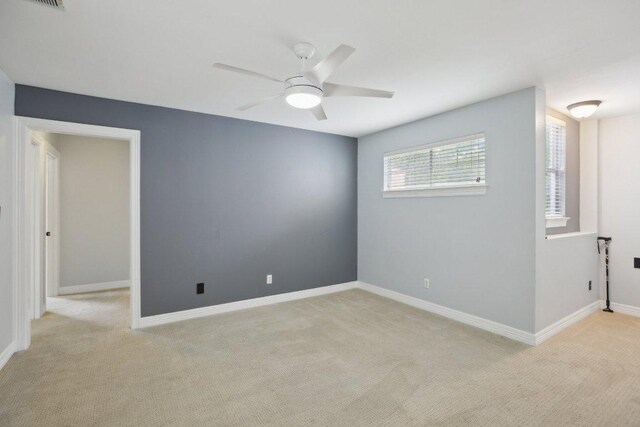 30418 La Quinta Dr, Georgetown, TX 78628 - unfurnished room with light colored carpet, a ceiling fan, and baseboards