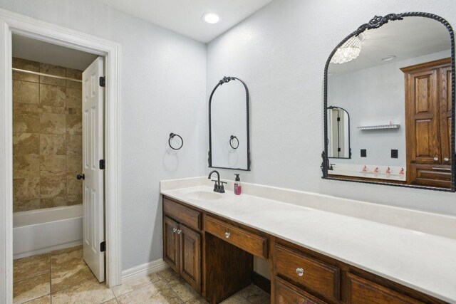 30418 La Quinta Dr, Georgetown, TX 78628 - full bath with vanity, tile patterned floors, shower / washtub combination, and baseboards