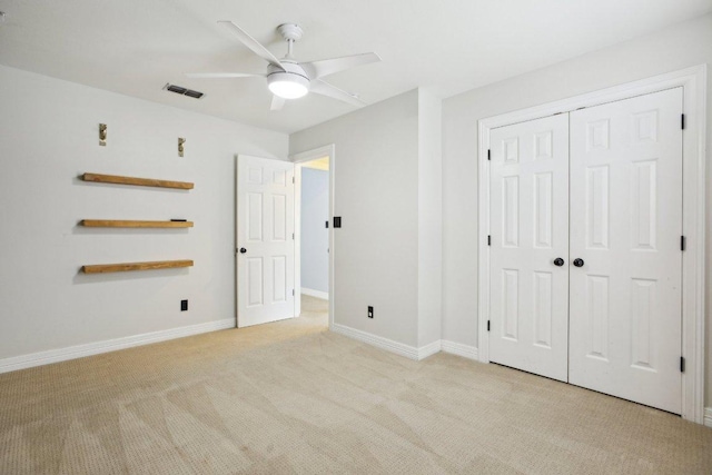 30418 La Quinta Dr, Georgetown, TX 78628 - unfurnished bedroom featuring light colored carpet, a closet, baseboards, and a ceiling fan