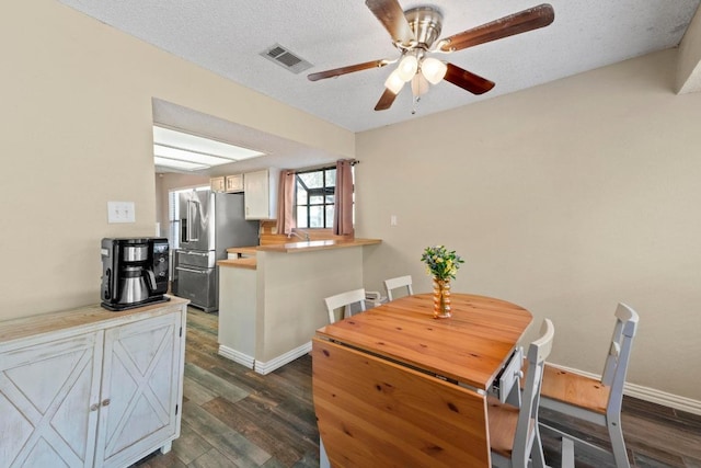 811 Timber Trl, Cedar Park, TX 78613 - dining room with dark wood-type flooring, a ceiling fan, and baseboards