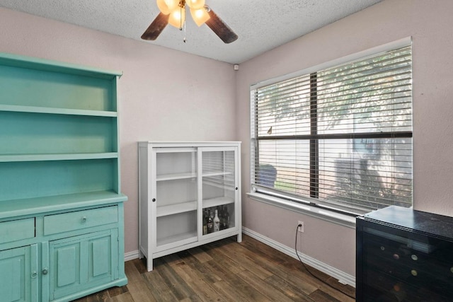 811 Timber Trl, Cedar Park, TX 78613 - unfurnished office with ceiling fan, dark wood-style flooring, a textured ceiling, and baseboards