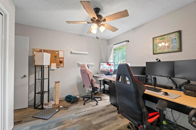 811 Timber Trl, Cedar Park, TX 78613 - office featuring wood finished floors, a ceiling fan, and a textured ceiling