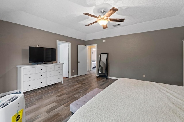 811 Timber Trl, Cedar Park, TX 78613 - bedroom with dark wood-type flooring, a ceiling fan, and baseboards