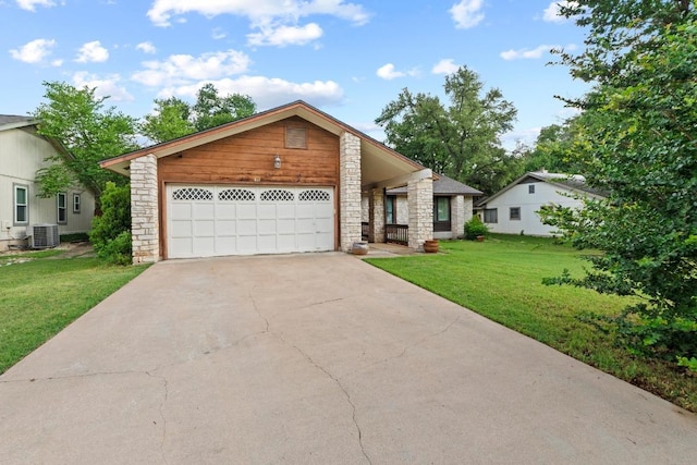 811 Timber Trl, Cedar Park, TX 78613 - view of front of home featuring central air condition unit, a front yard, stone siding, driveway, and an attached garage