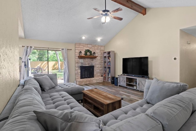 811 Timber Trl, Cedar Park, TX 78613 - living room featuring wood finished floors, ceiling fan, and a fireplace