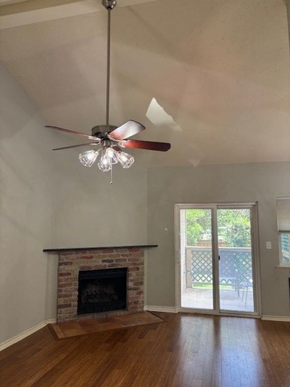 307 Quarry St, San Marcos, TX 78666 - unfurnished living room featuring a fireplace, hardwood / wood-style floors, and ceiling fan